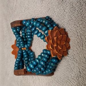 Vintage Handmade wooden Turquoise stretch beads and carved wood peices.